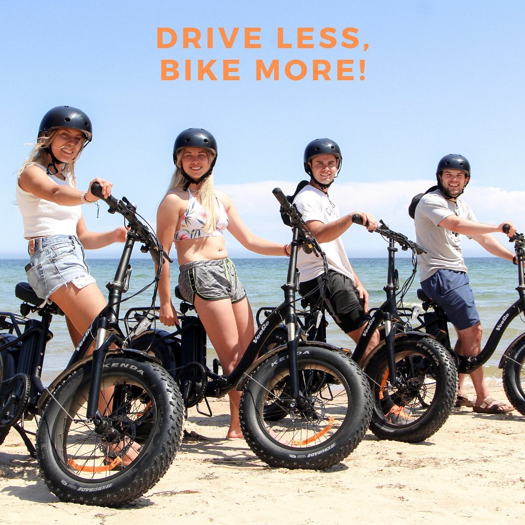 a group of people standing around a motorcycle