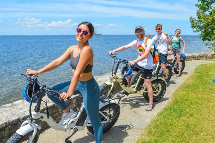 a group of people sitting at a beach